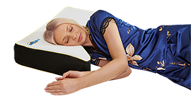 Woman sleeping peacefully on Snuggle Pillow